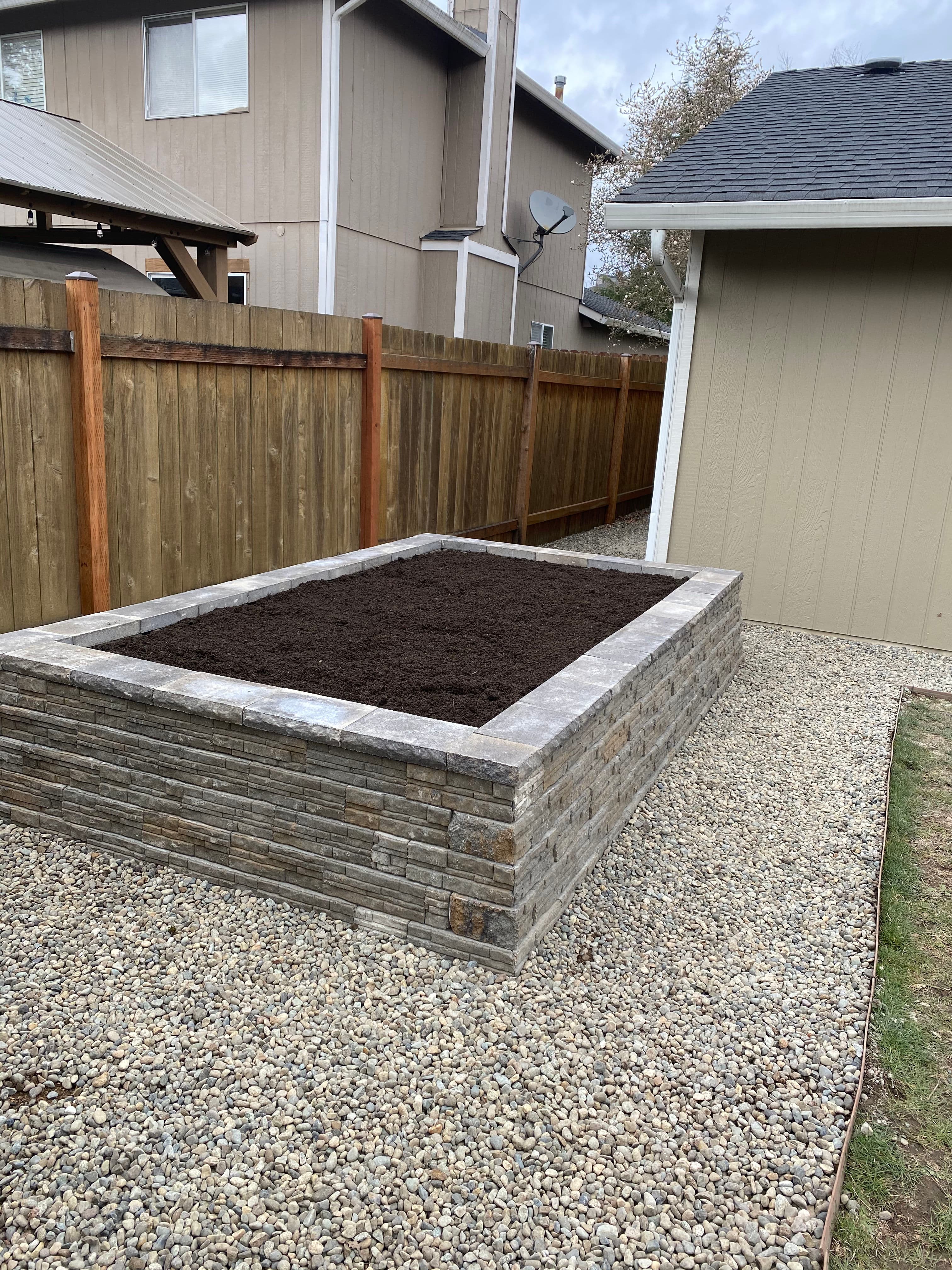 Project Custom Stone Raised Bed Installation for Garden Enthusiasts image